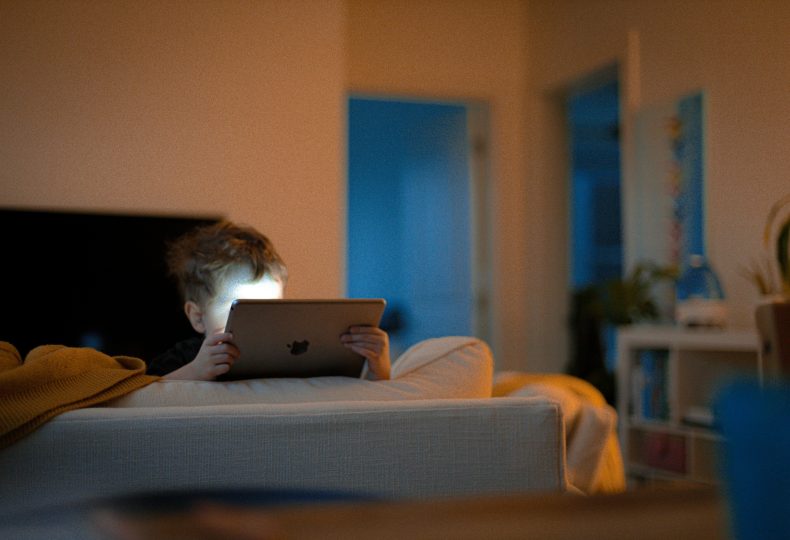 Young kid using an iPad